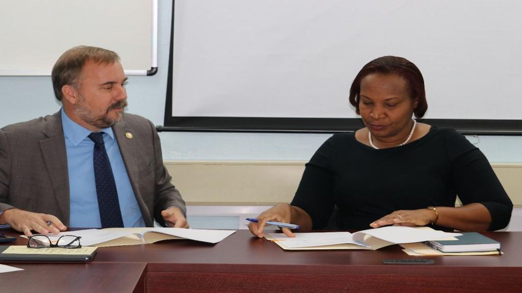 Representative and Country Director at the WFP Multi-country Office in Barbados Regis Chapman (Left) and St. Lucian Permanent Secretary Velda Octave-Joseph (Right) signing the Technical Assistance Agreement.