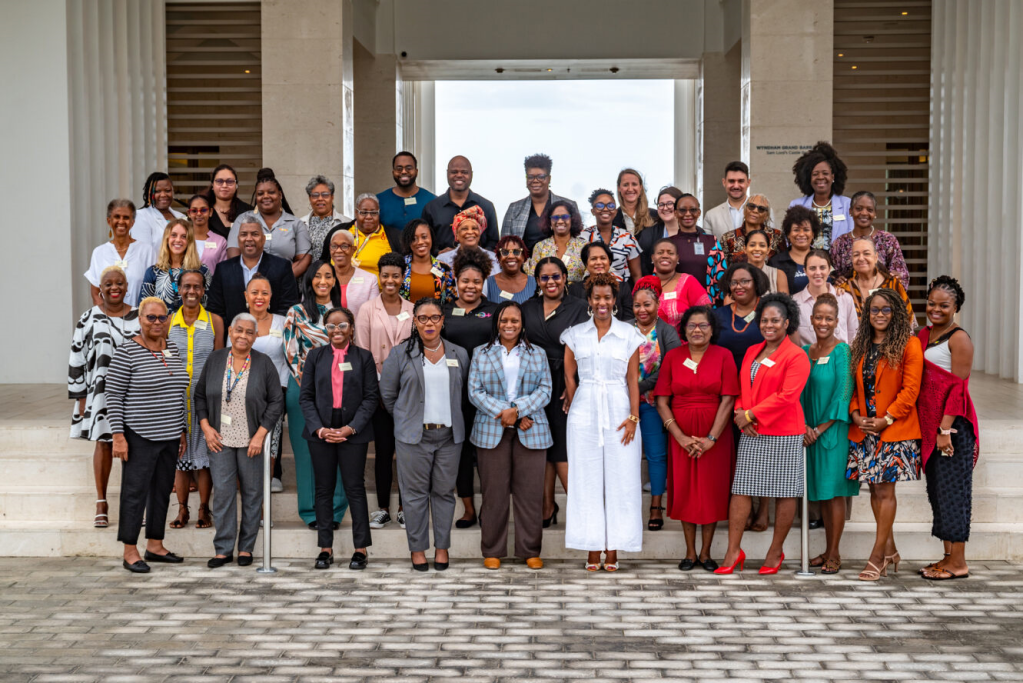 Tonni Brodber, Representative, UN Women Multi-Country Office (MCO) (Centre front) is joined by CSO participants that attended the Exchange.
