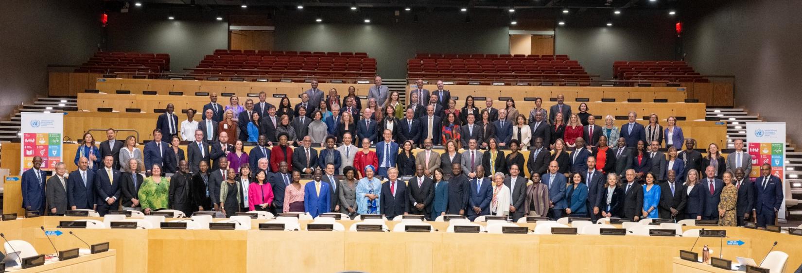 United Nations Resident Coordinators standing with Secretary General Antonio Guterres, and Deputy Secretary General Amina Mohammed at the Global Resident Coordinators Retreat, in New York.