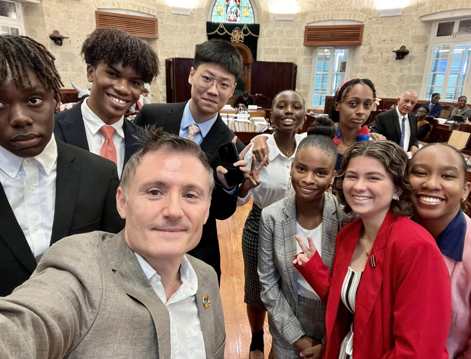 Group of young people taking a selfie with the Resident Coordinator