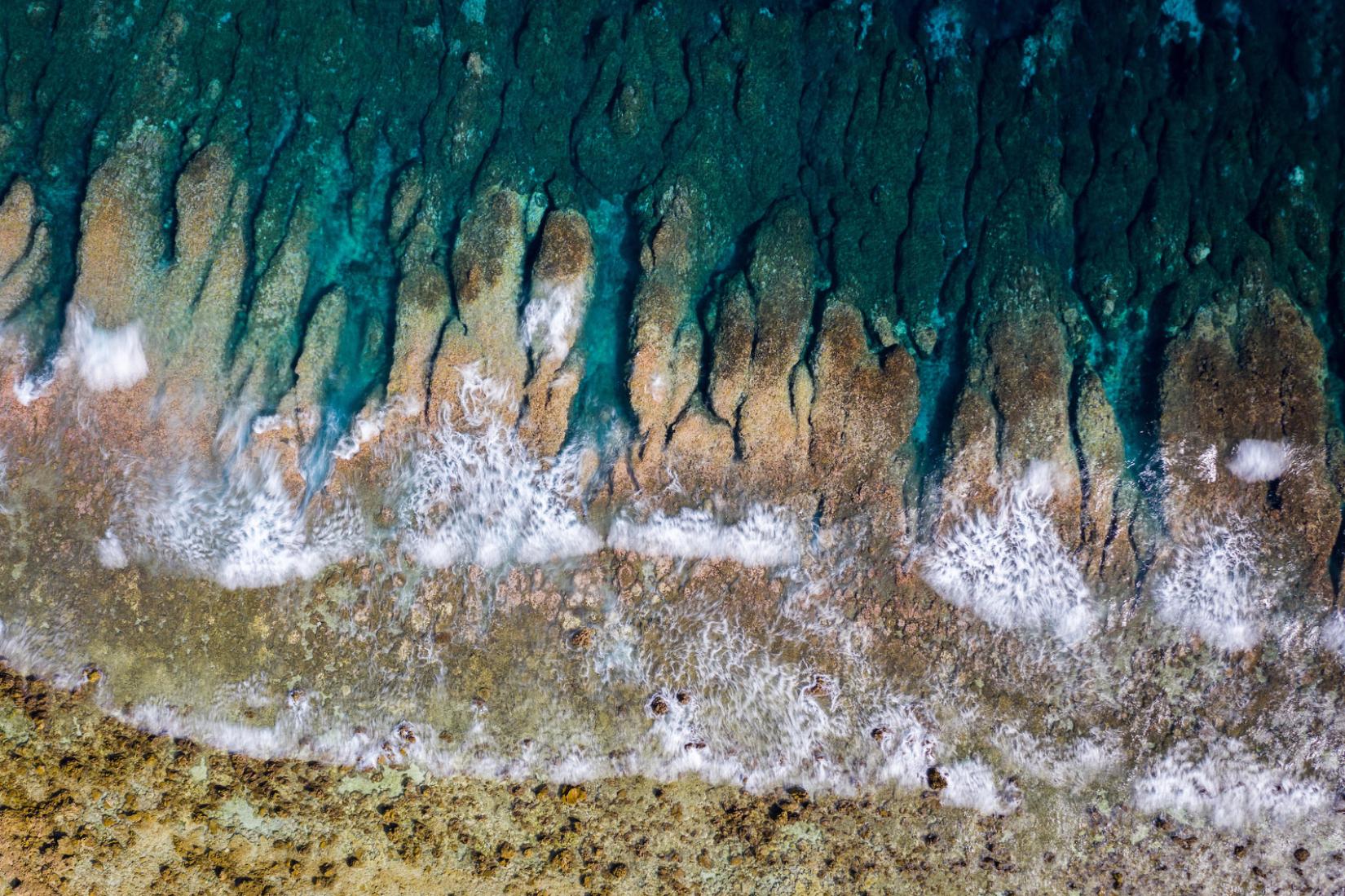 Waves from the Pacific Ocean crash onto Funafuti’s shoreline.