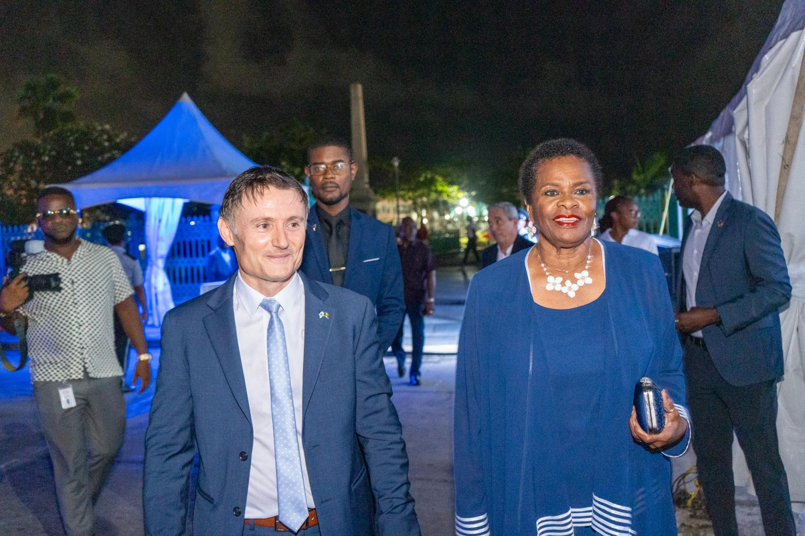 Dame Sandra Prunella Mason FB GCMG DA QC, President of Barbados enters the courtyard of the Barbados Parliament Buildings for the ceremony with Didier Trebucq, UN Resident Coordinator for Barbados and the Eastern Caribbean