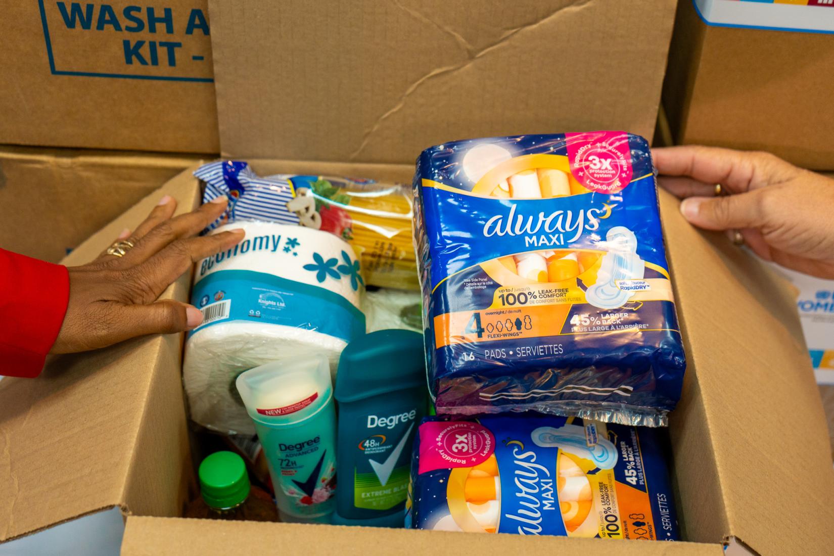 box containing personal hygiene items and food on display