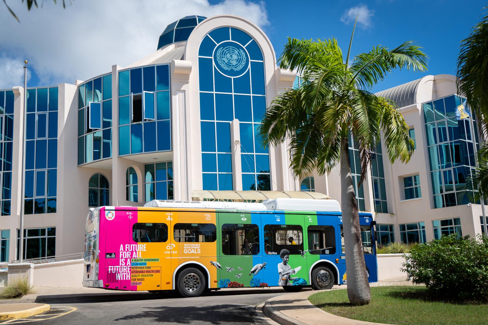 A SDG branded bus parked outside UN House in Barbados