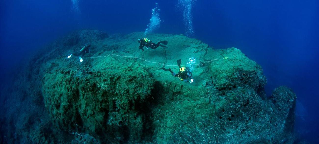 A team of scientific divers assess the marine biodiversity on the top of a seamount in Porto Santo, Madeira, Portugal.