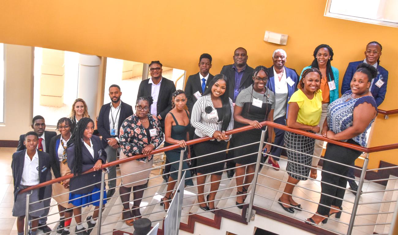 group of people standing together on stairs for a photo