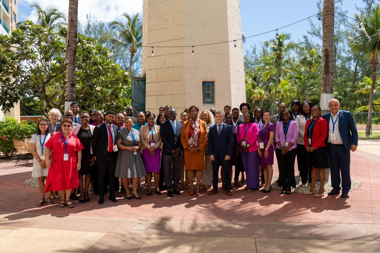 A group photo of the opening ceremony of the workshop, with government delegates from 13 Caribbean countries. 