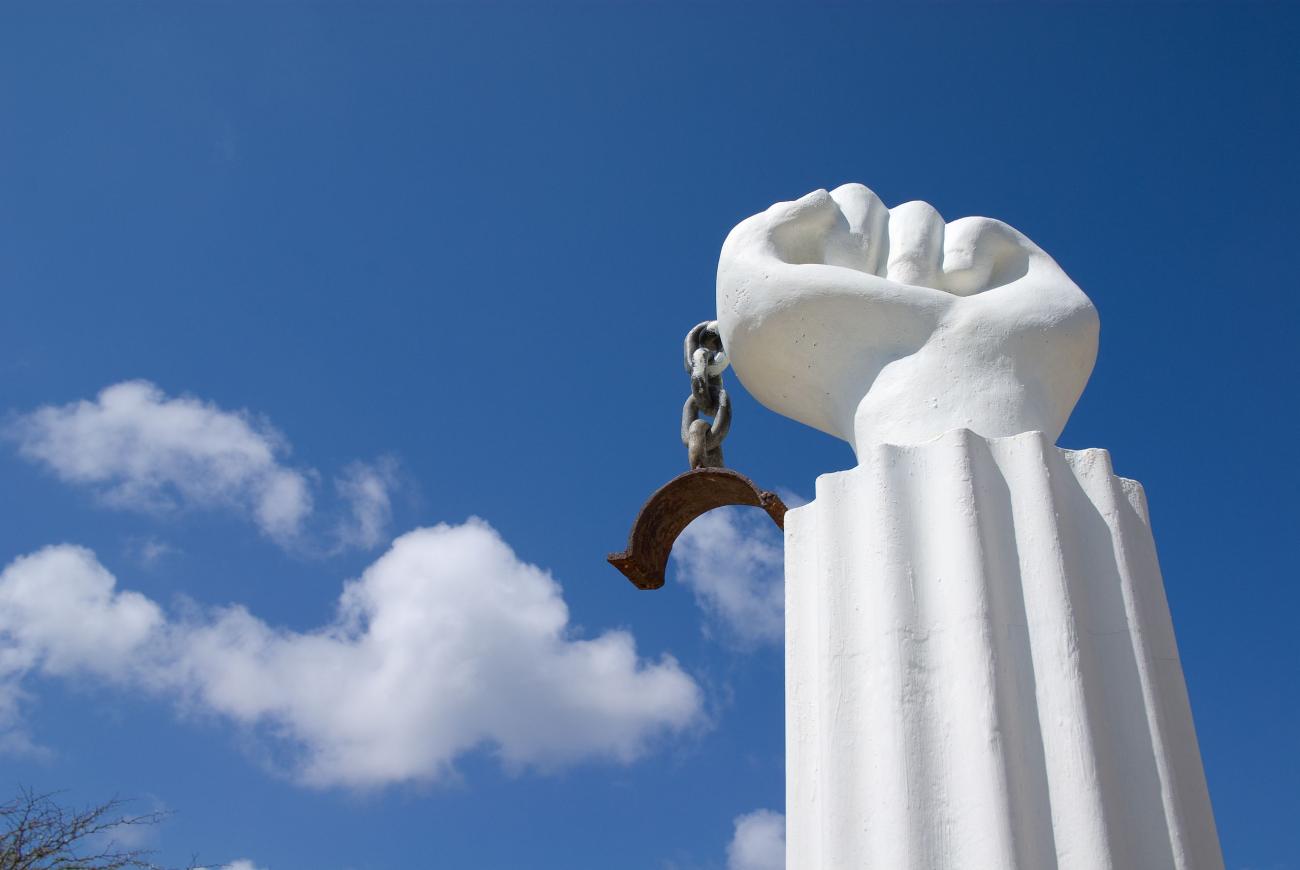 A statue of a fist with a chain