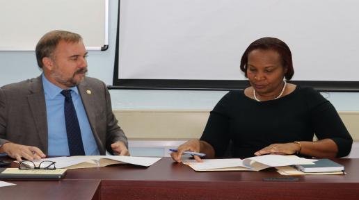 Representative and Country Director at the WFP Multi-country Office in Barbados Regis Chapman (Left) and St. Lucian Permanent Secretary Velda Octave-Joseph (Right) signing the Technical Assistance Agreement. 