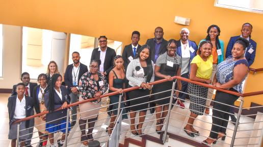group of people standing together on stairs for a photo